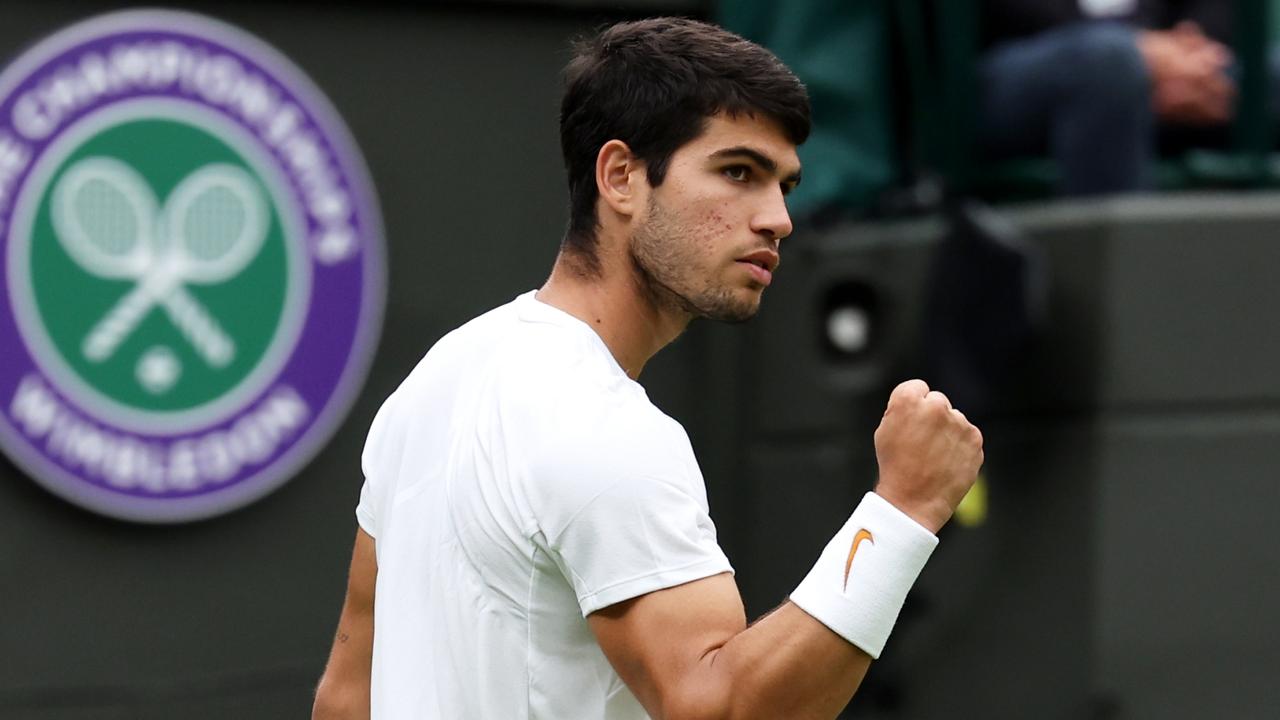 LONDON, ENGLAND - JULY 04: Carlos Alcaraz of Spain celebrates against Jeremy Chardy of France in the Men's Singles first round match during day two of The Championships Wimbledon 2023 at All England Lawn Tennis and Croquet Club on July 04, 2023 in London, England. (Photo by Michael Regan/Getty Images)