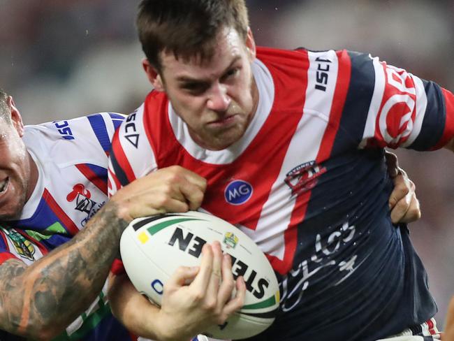 Newcastle's Mitchell Pearce tackles Roosters Luke Keary during the Sydney Roosters v Newcastle Knights rugby league match at Allianz Stadium, Sydney. Picture: Brett Costello