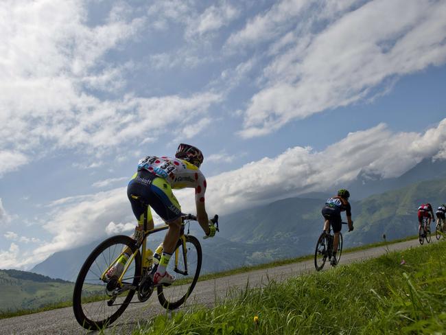 Poland's Rafal Majka (left) wearing the best climber's polka dot jersey rides in a breakaway during the 124.5km seventeenth stage of the Tour de France. Picture: Jeff Pachoud