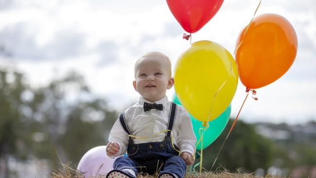 Little George McEntyre 9 months poses for a photograph at the Mount Gravatt Showgrounds, Thursday June 6, 2019. It has been 104 years since the inaugural Mt Gravatt Show took place. (AAP/Image Sarah Marshall)