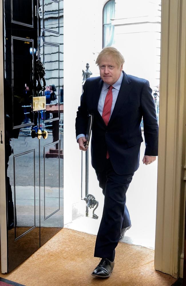 Britain's Prime Minister Boris Johnson returns to 10 Downing Street after making a statement to the media on his first day back at work. Picture: AFP