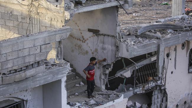 A Palestinian inspects the rubble of a destroyed house in Gaza City. Picture: Fatima Shbair/Getty Images