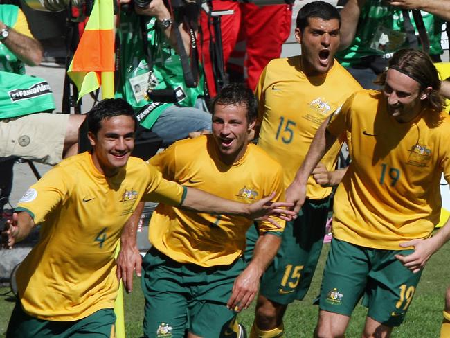 Tim Cahill (L) celebrates with teammates after scoring his second goal against Japan in their first round Group F World Cup football match at Kaiserslautern's Fritz-Walter Stadium.