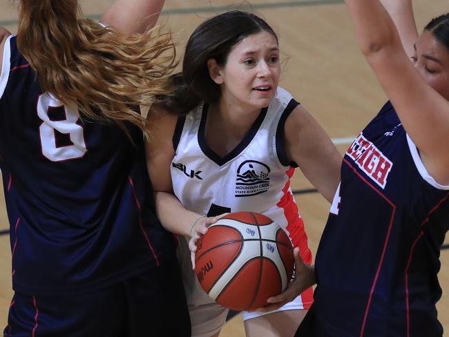 Zoe Byrne in action during the Molten CBSQ open competition game between Brisbane State High (blue) and Mountain Creek State High School (white) at Logan Metro Sports Sports Centre. Pics Adam Head