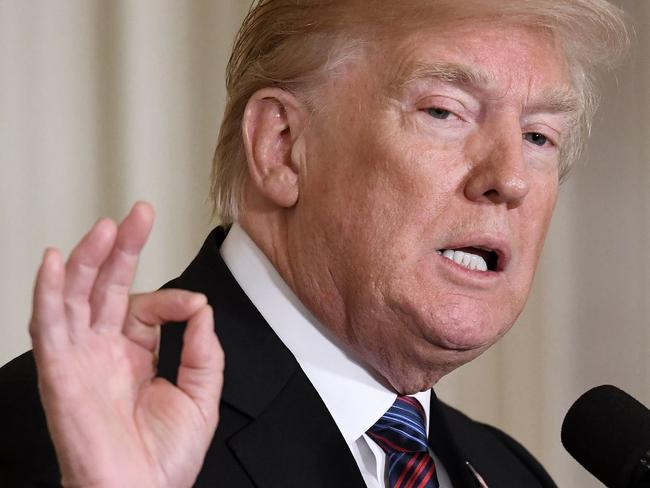 (FILES) In this file photo taken on April 3, 2018 US President Donald Trump speaks during a joint press conference with three Baltic States (Estonia, Latvia and Lithuania) in the East Room of the White House  in Washington, DC.   US President Donald Trump on April 6, 2018 defended his imposition of tariffs on metal imports, as soaring tensions with China fan global fears of an all-out trade war."Despite the Aluminum Tariffs, Aluminum prices are DOWN 4%," Trump tweeted, after The Wall Street Journal reported that the metal's price has fallen since early March when Trump slapped tariffs of 10 percent on aluminum and 25 percent on steel."People are surprised, I'm not! Lots of money coming into U.S. coffers and Jobs, Jobs, Jobs!"  / AFP PHOTO / Olivier Douliery