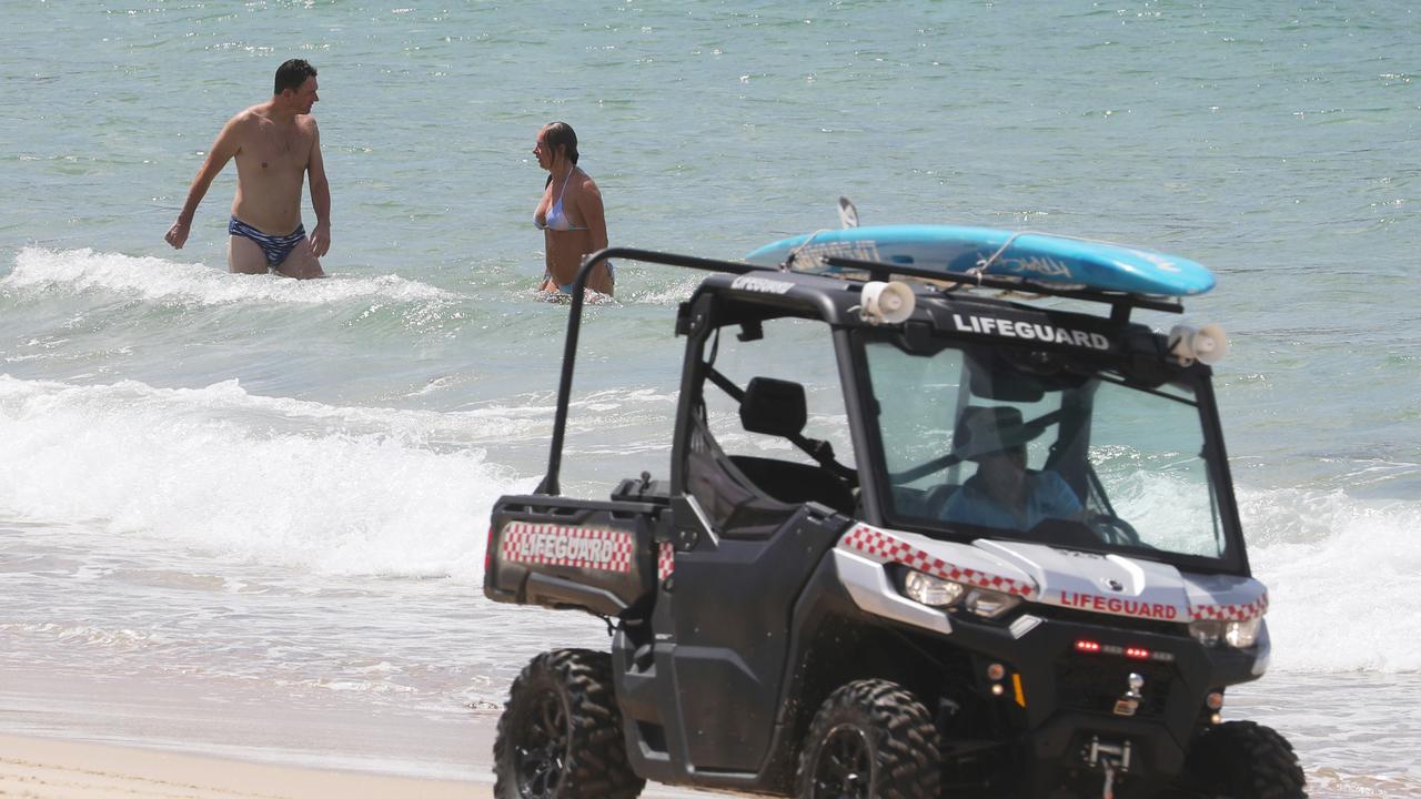 Lifeguards tell paddlers to exit Coogee beach today. Picture: John Grainger