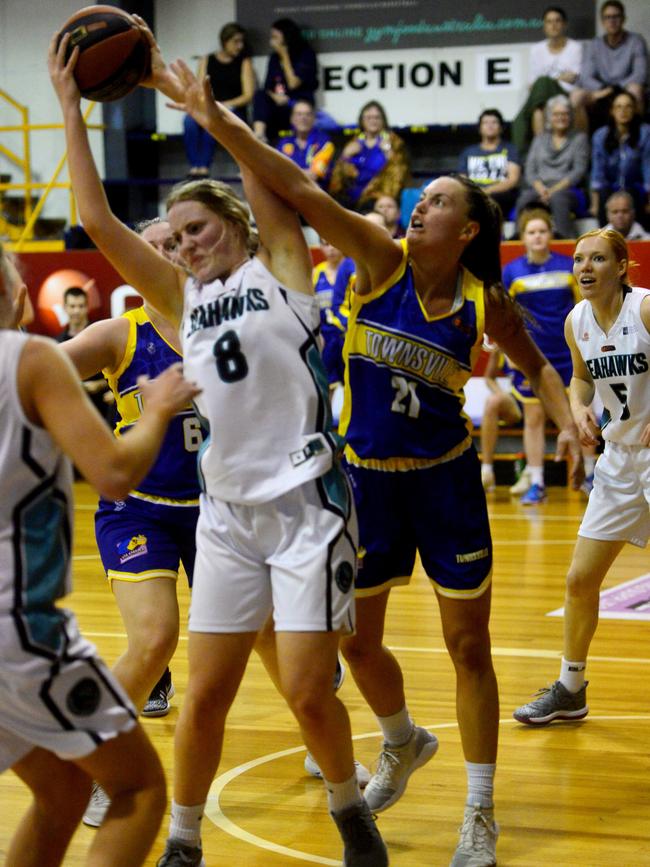 Queensland Basketball League quarter finals at Townsville Basketball Stadium. Townsville Flames against North Gold Coast Seahawks. Seahawks' Charli Reece and Flames' Stella Beck. Picture: Evan Morgan
