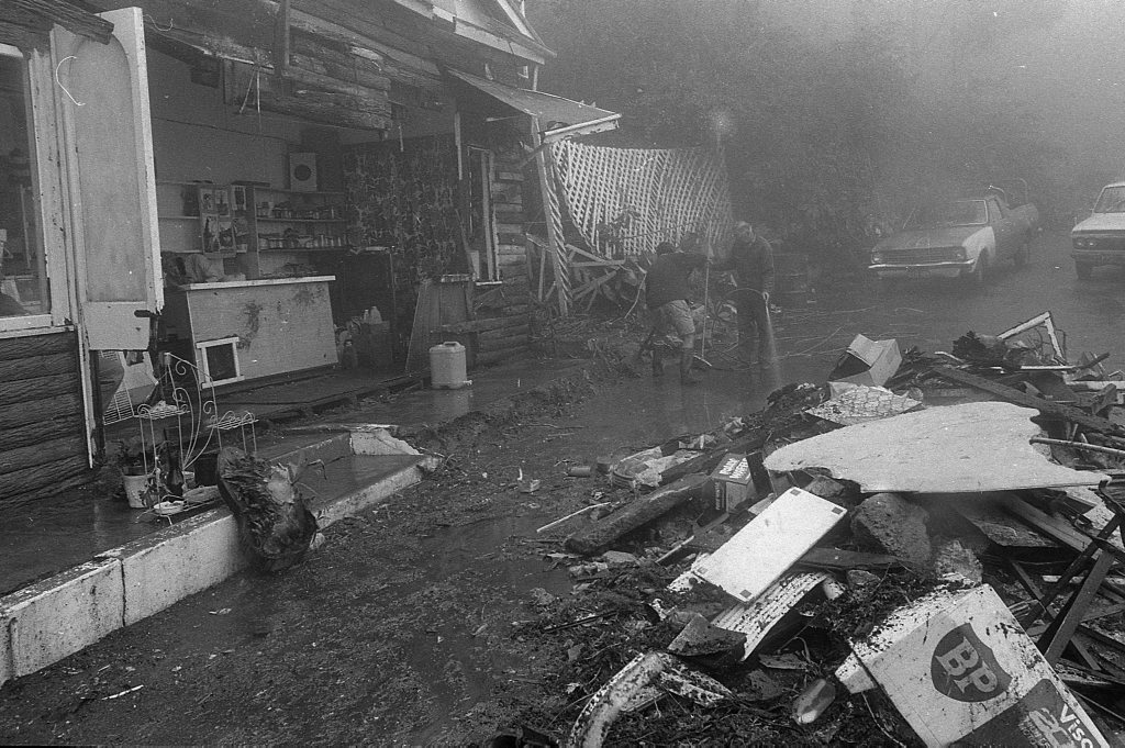 Historic: Toowoomba: Accidents: Clean up at the Log Cabin Service Station the morning after a semi-trailer rolled and crashed in the building removing most of the front of the station. The owner in 1978, Mr Neville Hammond started rebuilding immediately. Photo: Bruce Mackenzie / The Chronicle Neg: U875. Picture: Bruce Mackenzie