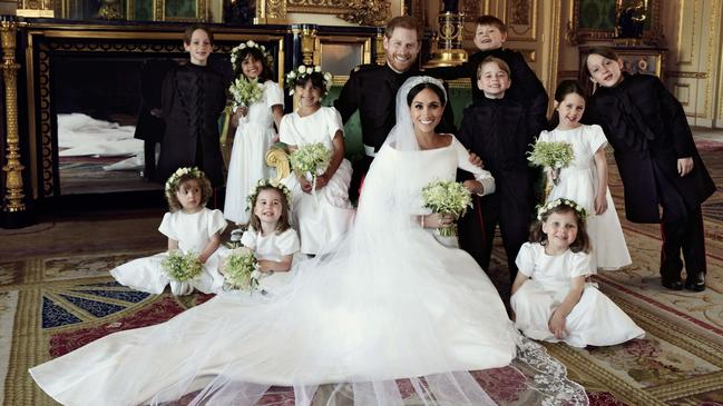 Prince Harry and Meghan Markle, centre, in Windsor Castle, Windsor, England. Others in photo from left, back row, Brian Mulroney, Remi Litt, Rylan Litt, Jasper Dyer, Prince George, Ivy Mulroney, John Mulroney; front row, Zalie Warren, Princess Charlotte, Florence van Cutsem. Picture: Alexi Lubomirski