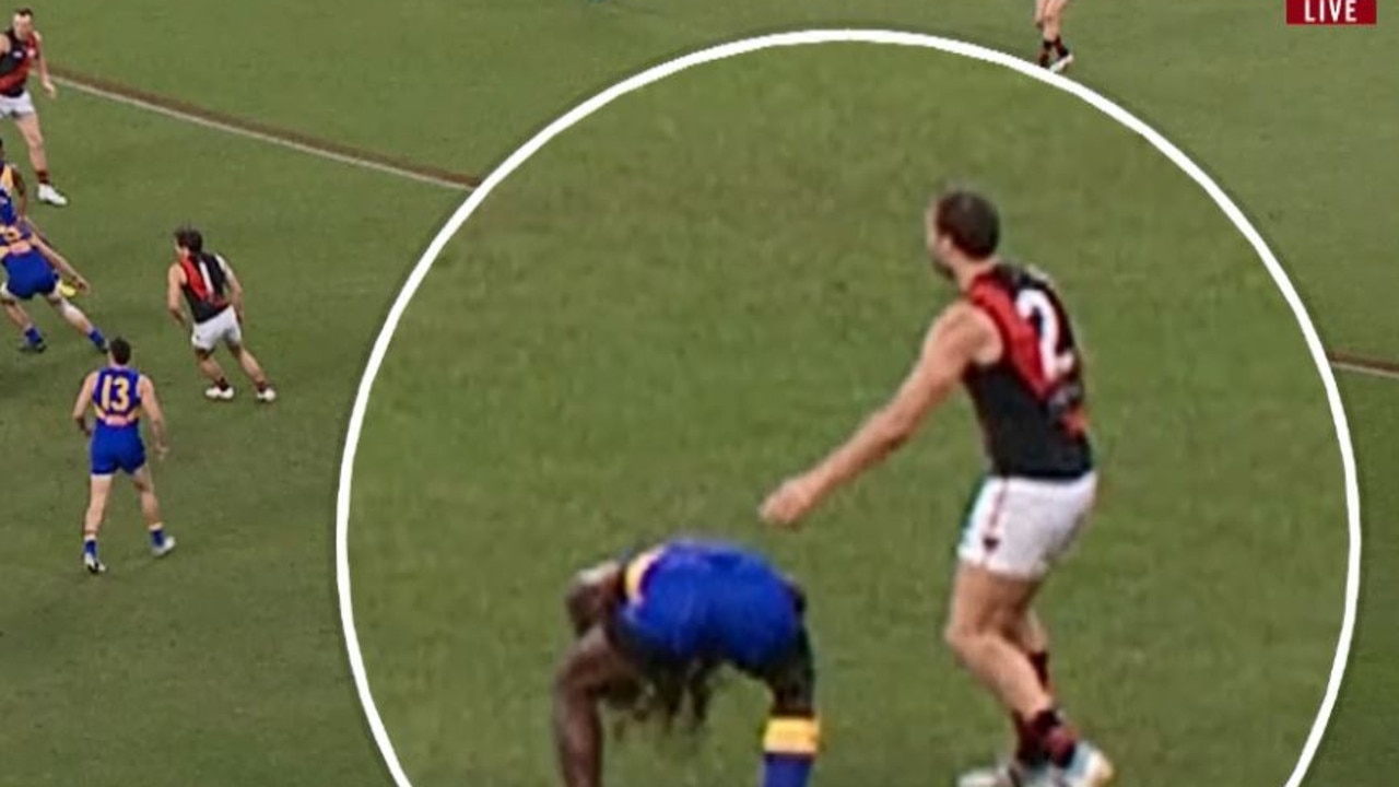 West Coast sar Nic Naitanui goes down after being struck by Tom Bellchambers.