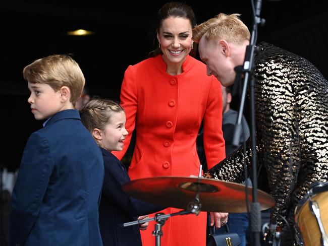 Duchess of Cambridge and Prince George and Princess Charlotte meet the performers as part of the royal family's tour for Queen Elizabeth II's celebrations. Picture: AFP