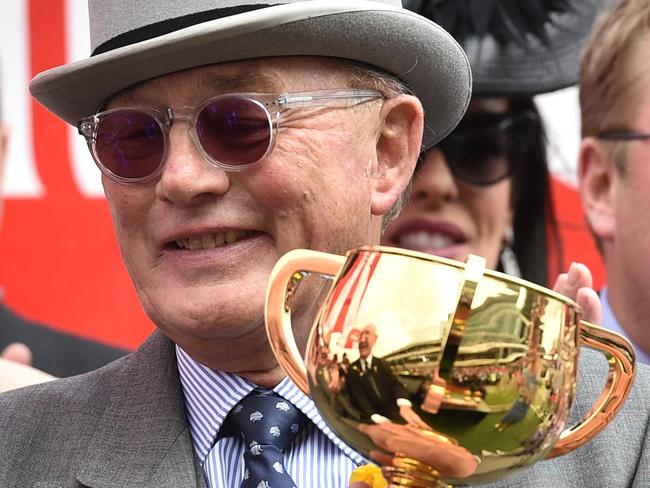 Lloyd Williams holds the Melbourne Cup after Almandin won the race at Flemington Racecourse in Melbourne, Tuesday. Nov. 1, 2016. (AAP Image/Julian Smith) NO ARCHIVING, EDITORIAL USE ONLY