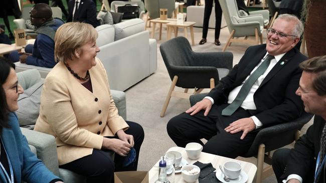 Scott Morrison, right, with Angela Merkel in Glasgow on Tuesday. Picture: Adam Taylor