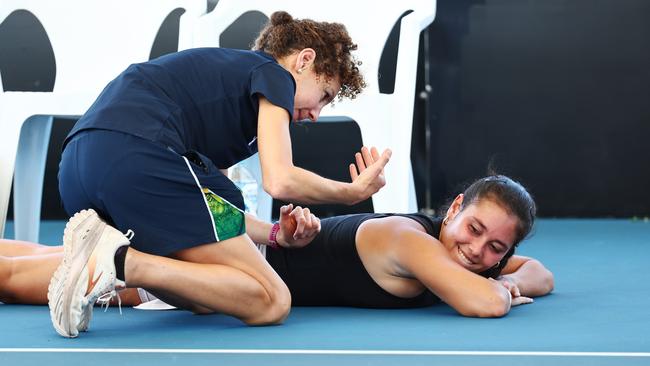 Carolann Delaunay receives a massage before going on to win her match in the International Tennis Federation (ITF) Cairns Tennis International qualifying match at the Cairns International Tennis Centre. Picture: Brendan Radke