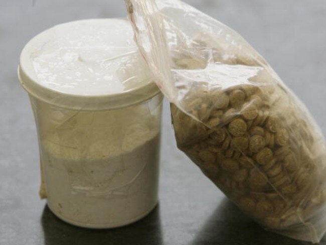 Captagon pills are displayed along with a cup of cocaine at an office in this file pic.