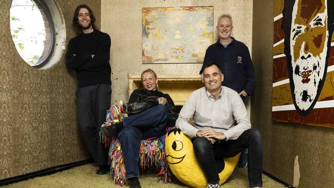 From left, standing, Rupert McEvoy and David Art Wales, and, sitting, Alba Tijm and Brody Petersen pose for a photo with some of the art on show as a tribute to legendary owner Doris Goddard. Picture: Daily Telegraph/ Monique Harmer