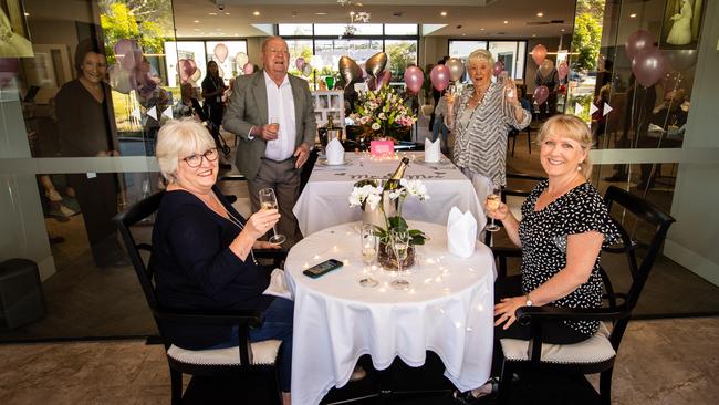 Social-distancing at the 65th wedding celebrations of Faye and Barry Bosward at Arcare Warriewood. Celebrating with them at the 'high tea' serving were daughters Julie Gilroy, left and Leanne Jelfs. (AAP Image / Julian Andrews).