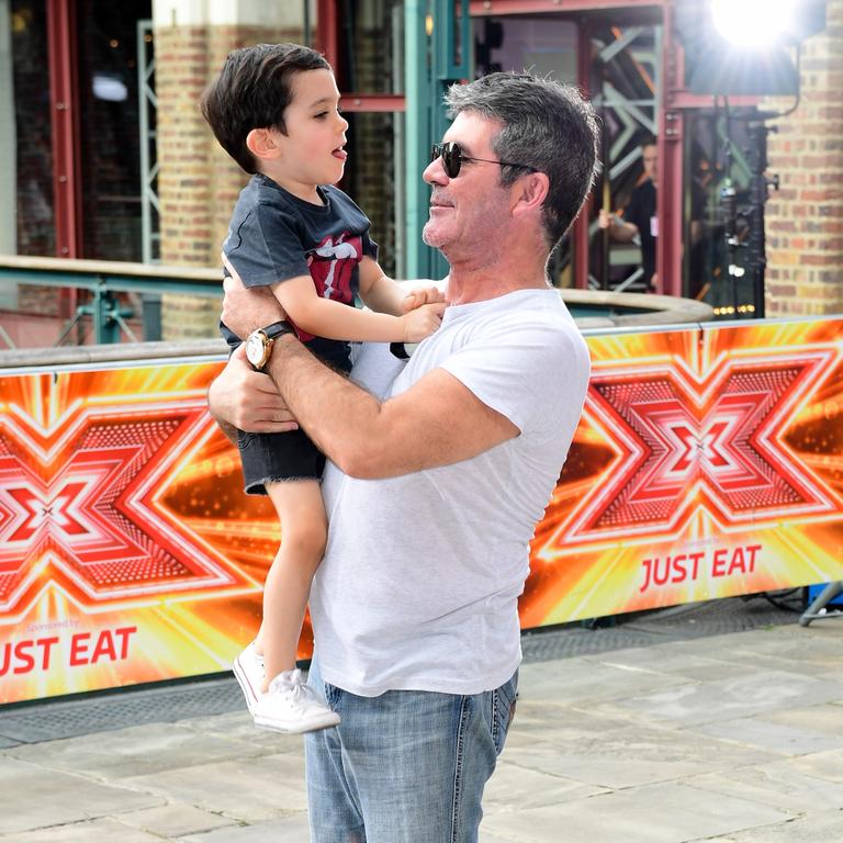 Cowell’s wound down his partying ways and is a devoted dad to son Eric. Picture: Getty