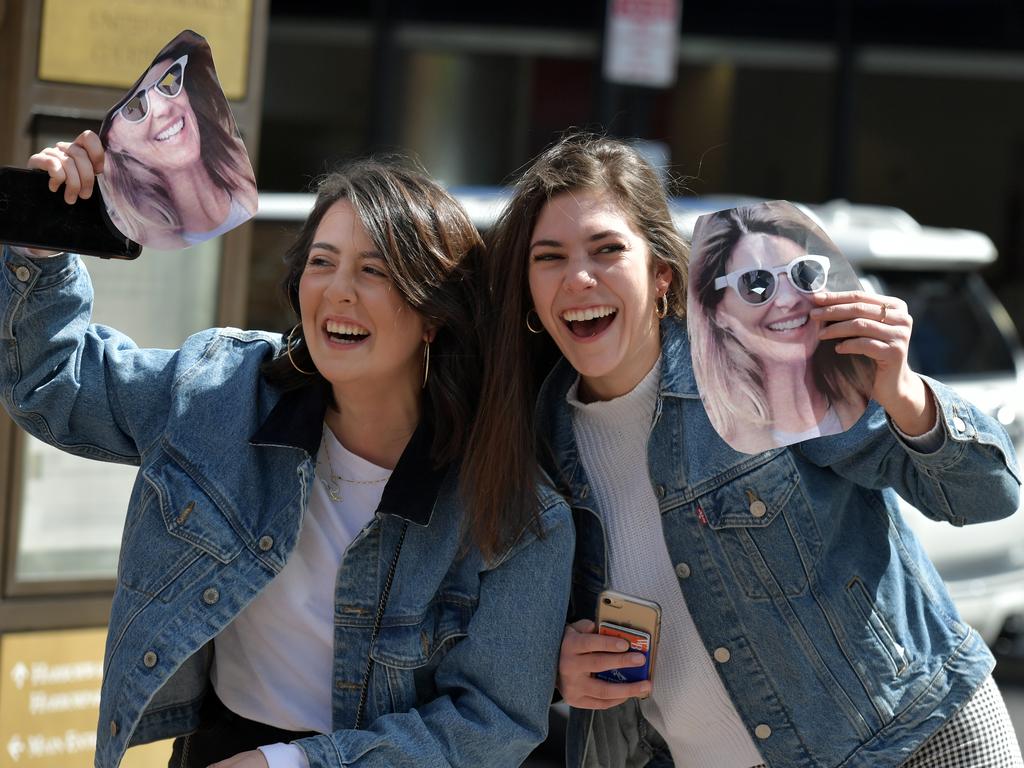 Fans of Lori Loughlin hold photo masks of the actress outside a Boston court where she appeared last week. Picture: Getty Images