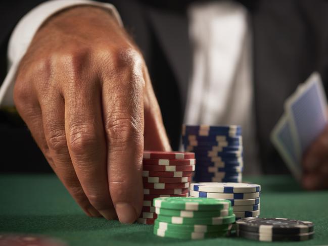 card player gambling casino chips on green felt background selective focus