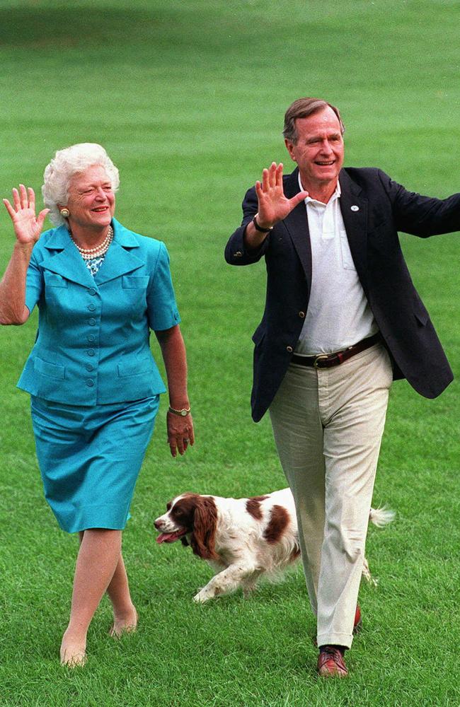 Barbara, George Bush and pet dog Millie on the south lawn of the White House, August 1992.