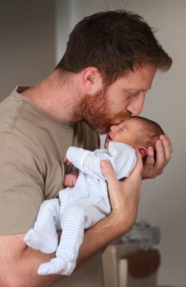 Former Richmond Tigers and Fremantle Dockers player Reece Conca and son Gio at home. Picture: David Caird