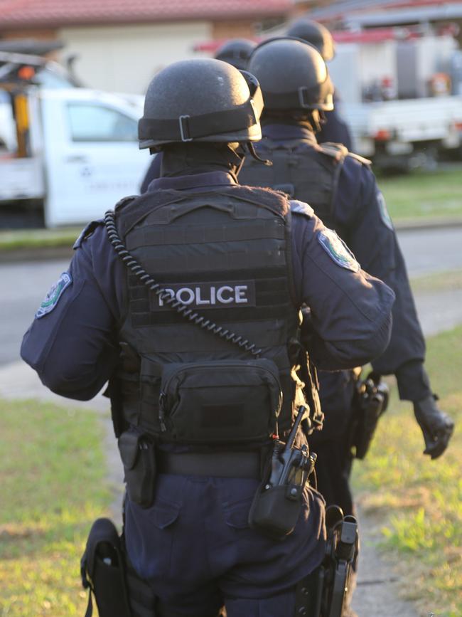 Police storm a home in Dean Park after a Strike Force Raptor investigation into the Finks bikie gang. Picture: NSW Police