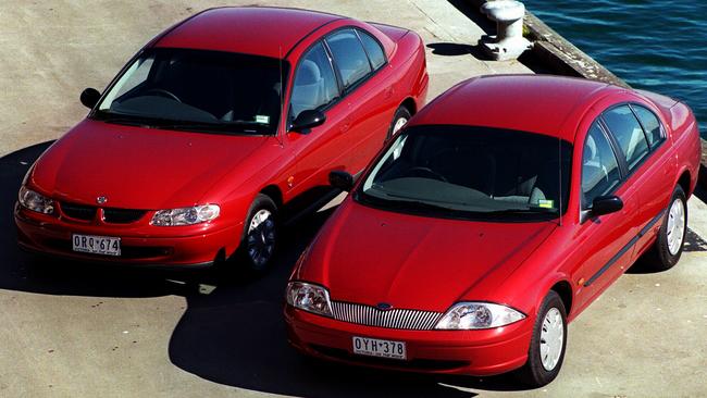 The AU Falcon and the more conventionally-styled Holden VT Commodore. Picture: News Corp