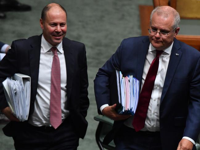 CANBERRA, AUSTRALIA - FEBRUARY 25: Treasurer Josh Frydenberg and Prime Minister Scott Morrison during Question Time in the House of Representatives at Parliament House on February 25, 2021 in Canberra, Australia. Prime Minister Scott Morrison has lost a working majority in parliament after the Member for Hughes Craig KellyÃ¢â¬â¢s resigned yesterday and moved to the crossbench, warning he is prepared to vote against the government. Mr KellyÃ¢â¬â¢s decision to quit the Liberal Party came after the Prime Minister demanded he stop spreading misinformation about COVID-19 and take action against his office manager, Frank Zumbo, who faces allegations of inappropriate behaviour. (Photo by Sam Mooy/Getty Images)