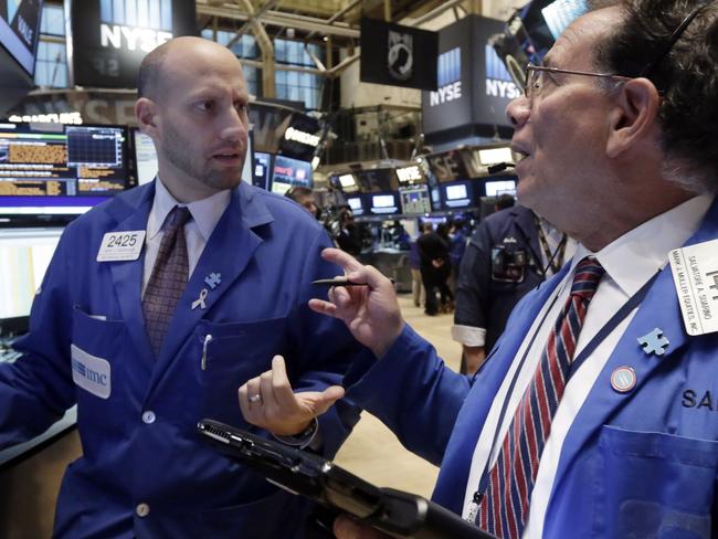 Specialist Meric Greenbaum, left, and trader Sal Suarino work on the floor of the New York Stock Exchange, Friday, Oct. 2, 2015. A weak report on the U.S. jobs market is sending the stock market and the dollar sharply lower in early trading. (AP Photo/Richard Drew)