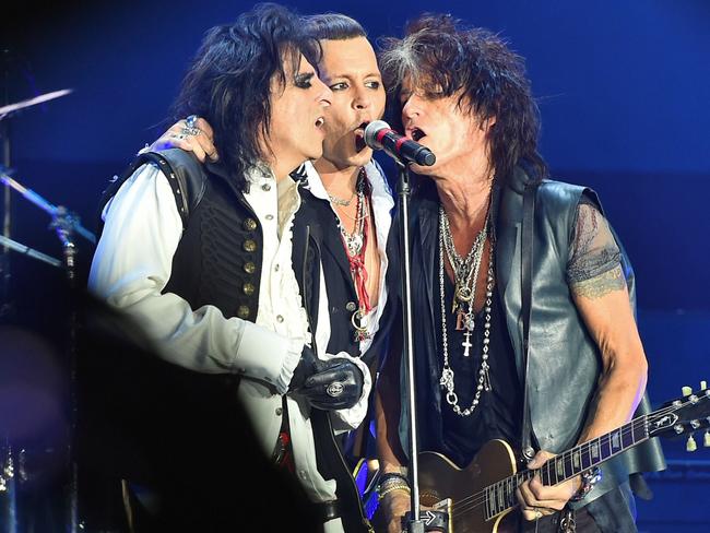 The Hollywood Vampires - Alice Cooper, Johnny Depp and  Joe Perry — performing at Moscow’s Olympic stadium last week.