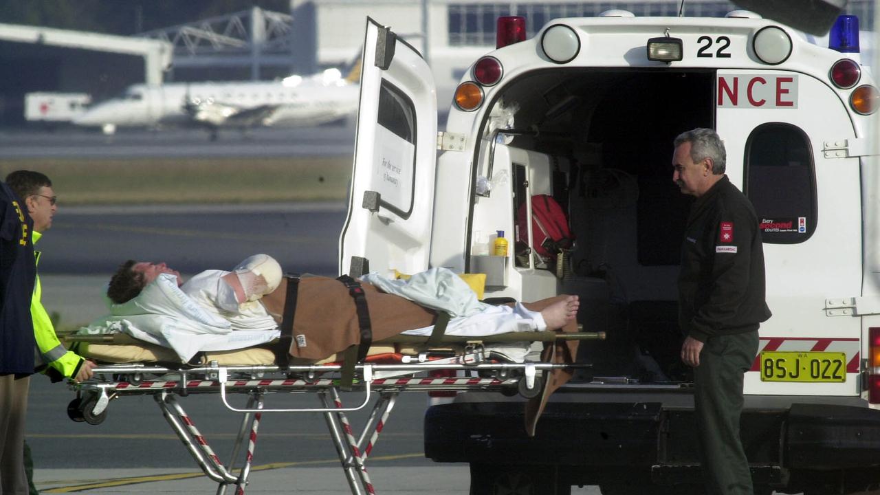 An Injured victim being taken from RAAF VC10 plane to a waiting ambulance at Perth Airport after being evacuated on October 15, 2002.