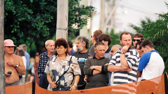 Crowds form to watch as police investigate the scene at Cremorne. Picture: Lee Constable