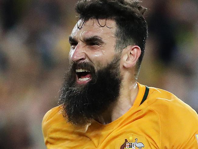 Socceroos Mile Jedinak celebrates after scoring his third goal during the Australia v Honduras World Cup decider at ANZ Stadium, Sydney. Picture: Brett Costello