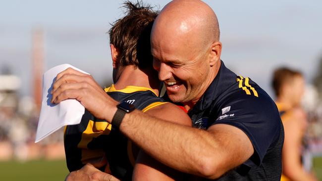 Matthew Nicks gives Matt Crouch a hug after their surprise win at Mars Stadium. Picture: Dylan Burns/AFL Photos via Getty Images