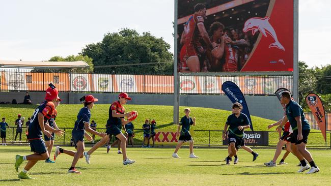 The Dolphins run young fans through some drills at a schools competition, shortly after the announcement of the Dolphins partnering with the Northern Territory Government to play a series of home games at Territory Rugby League Stadium. Picture: NT Major Events Company: Verity Griffin