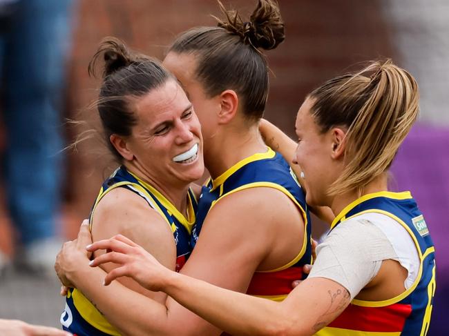 ADELAIDE, AUSTRALIA - NOVEMBER 16: Chelsea Randall of the Crows celebrates a goal with teammates during the 2024 AFLW First Semi Final match between the Adelaide Crows and the Fremantle Dockers at Norwood Oval on November 16, 2024 in Adelaide, Australia. (Photo by Dylan Burns/AFL Photos via Getty Images)