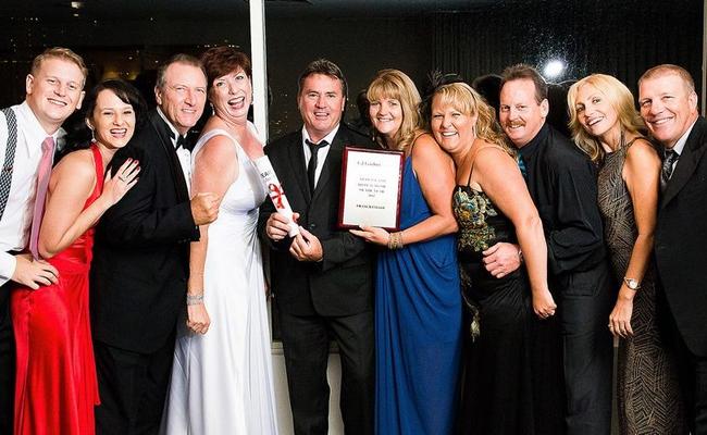 The GJ Gardener team from Hervey Bay and their partners after winning the company's statewide Display Home of the Year award. Picture: Contributed