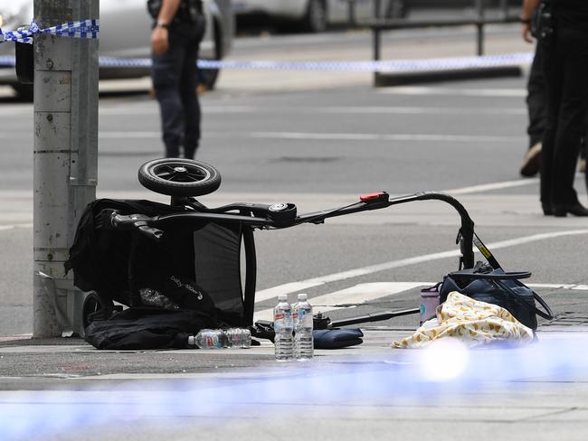 A pram left at the corner of Bourke and William streets. Picture: Picture: AAP Image/Julian Smith