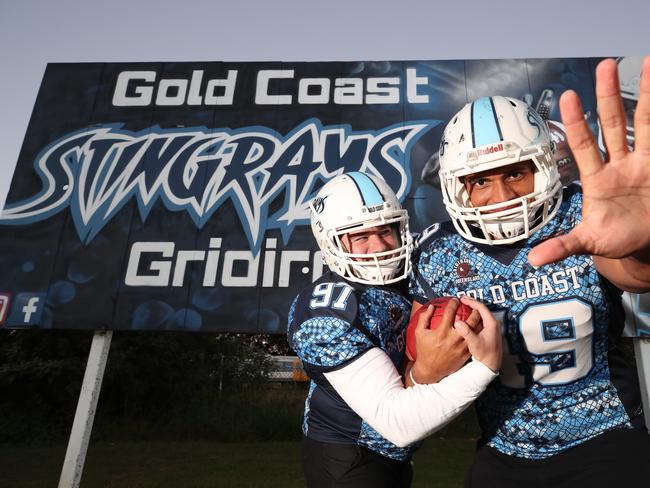 Gold Coast Stingrays players have been used as extras in the Young Rock tv show. Club captain Lance Tongakilo actually worked as his stunt double. Stingray and film extra James Booth with Lance Tongakilo at training at Nerang. Picture Glenn Hampson