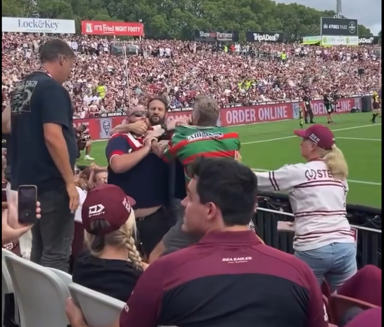 Souths and Roosters fans go at it at the 4 Pines Park in Round 2.