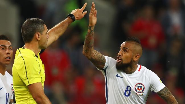 Arturo Vidal of Chile appeals to referee Damir Skomina.