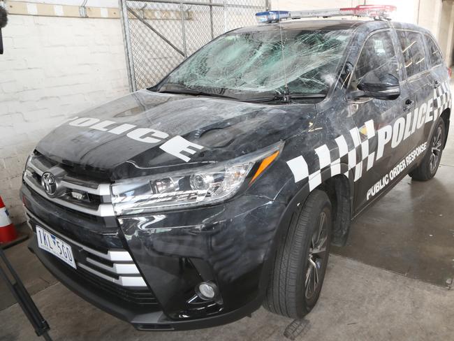 One of four police cars that were damaged when police tried to break up an Airbnb party in North Melbourne. Picture: David Crosling