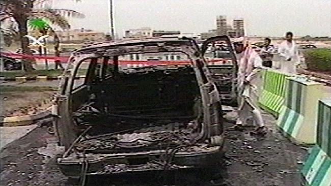 A TV grab taken from official Saudi television shows a burnt car at one of the sites of triple attacks targeting oil facilities by suspected Islamist militants in the eastern oil city of al-Khobar 29 May 2004