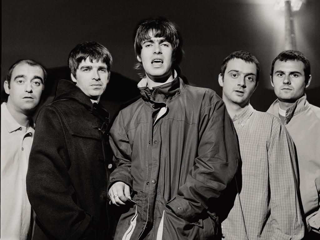 The classic 1995 Oasis line-up, from left, Paul “Bonehead” Arthurs, Noel Gallagher, Liam Gallagher, Paul McGuigan and Alan White. Picture: Supplied