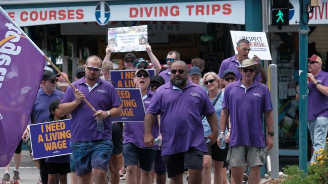 A protest of Lotus Glen Correctional Centre staff and their families as well as Together Union members marched on Cook MP Cynthia Lui's office in the Cairns CBD last week. The march was led by Lotus Glen employees John Burley (left) and Basil Kidu (right).