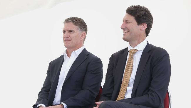 Rugby great John Eales (right) attends the unveiling of a bronze statue of himself alongside Tim Horan outside Suncorp Stadium.