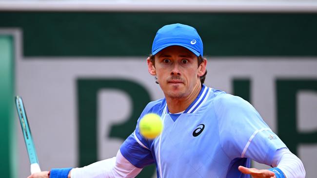 PARIS, FRANCE - MAY 28: Alex De Minaur of Australia plays a forehand against Alex Michelsen of United States in the Men's Singles first round match on Day Three of the 2024 French Open at Roland Garros on May 28, 2024 in Paris, France. (Photo by Clive Mason/Getty Images)