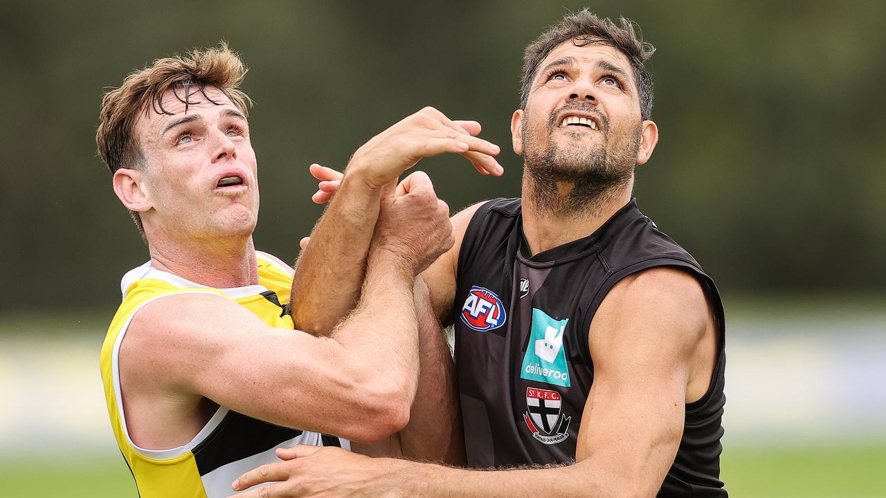 Paul Hunter (left) tangles with Paddy Ryder at St Kilda training.