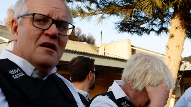 Former British Prime Minister Boris Johnson and former Australian Prime Minister Scott Morrison visit Kibbutz Kfar Aza following the October attack by Hamas gunmen from the Gaza Strip, in southern Israel, November 5, 2023. REUTERS/Evelyn Hockstein